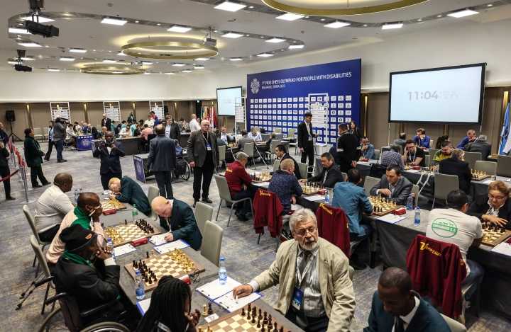 Visually impaired chess player Darpan Inani shows his opponents he