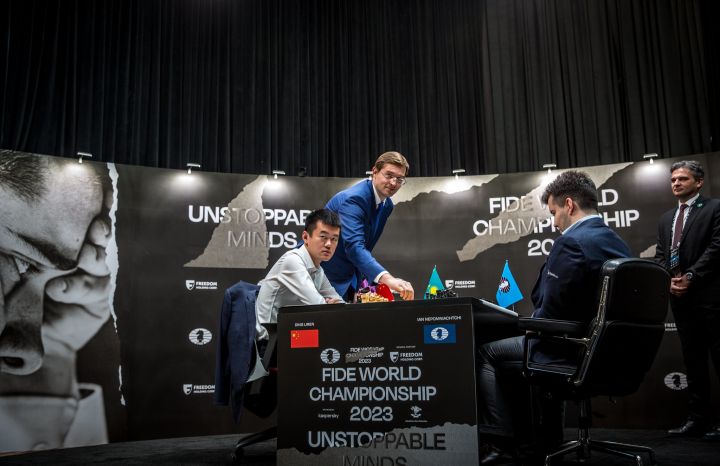 China's Ding Liren, left, and Russia's Ian Nepomniachtchi shake hands prior  to their FIDE World Chess Championship in Astana, Kazakhstan, Saturday,  April 29, 2023. Ian Nepomniachtchi and Ding Liren are facing off