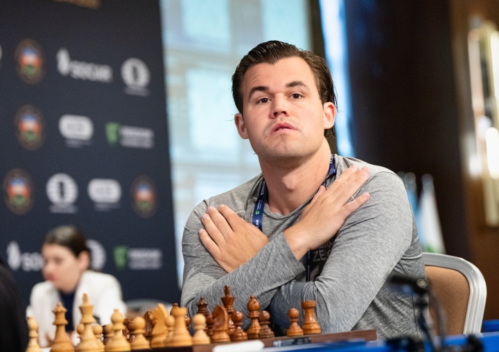 Carlsen and Tan seal key wins in round five openers at FIDE World