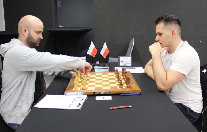 Two chess masters face off in an international tourn