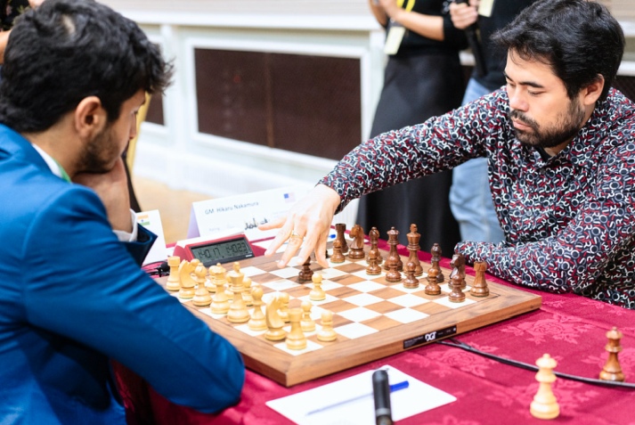 Caruana misses a Tal-like combination, but still wins in Round 8